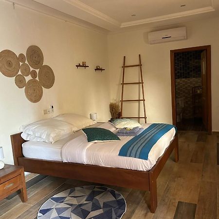 L'Oasis Guesthouse Cotonou Exterior photo
