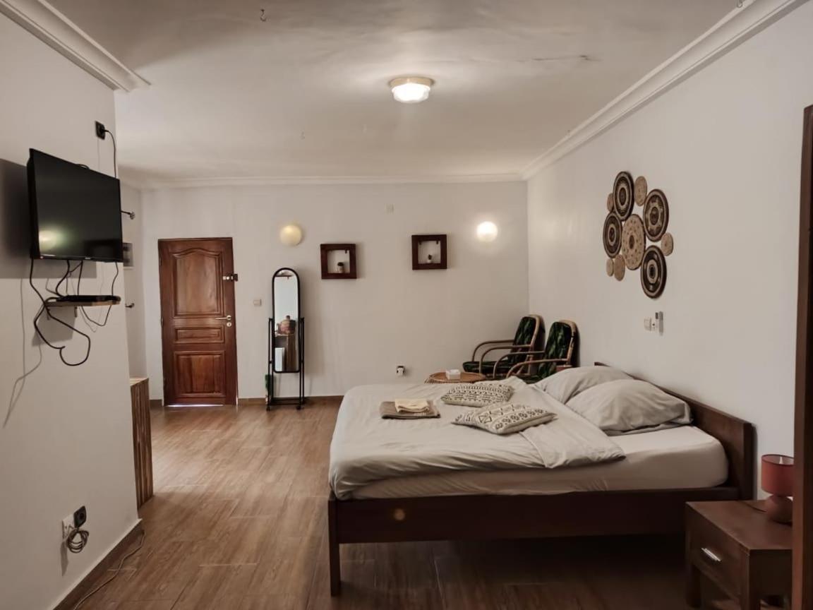 L'Oasis Guesthouse Cotonou Exterior photo