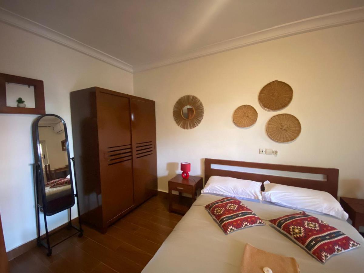 L'Oasis Guesthouse Cotonou Exterior photo