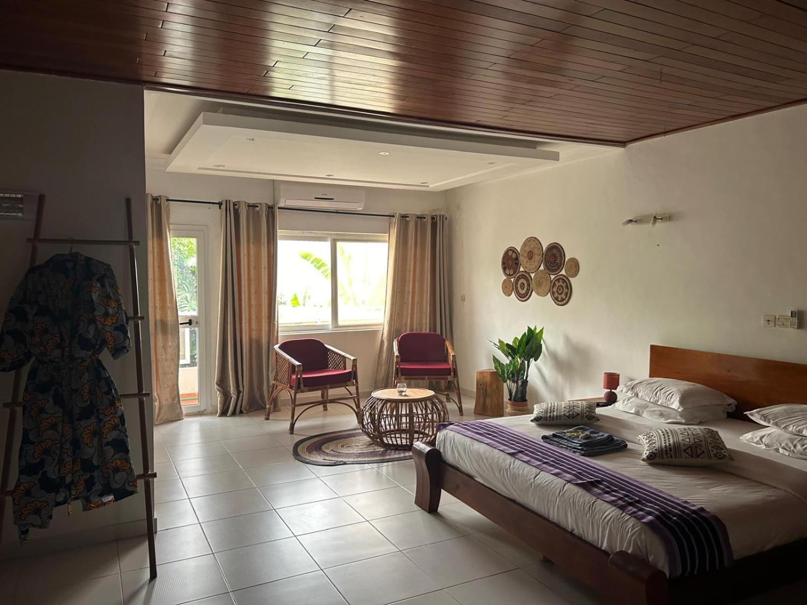 L'Oasis Guesthouse Cotonou Exterior photo
